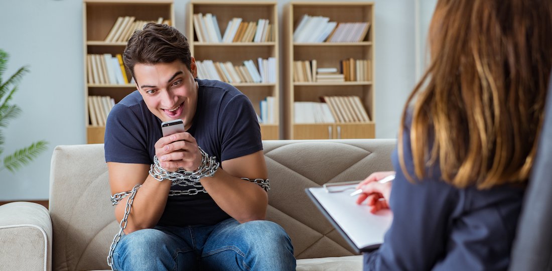 Man suffering from phone dependence visiting doctor Mindfulness and Mental Health