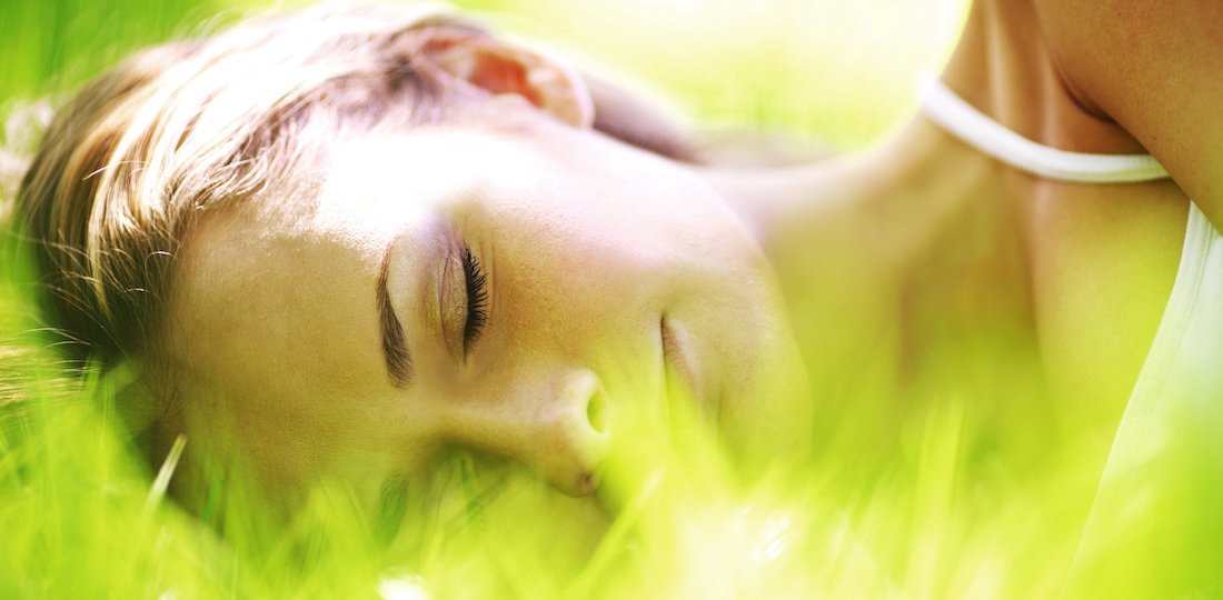 woman sleeps on grass Sleep and Mental Health