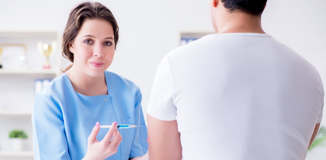 Patient visitng doctor for annual flu shot inoculation for preve Trigger Point Injections